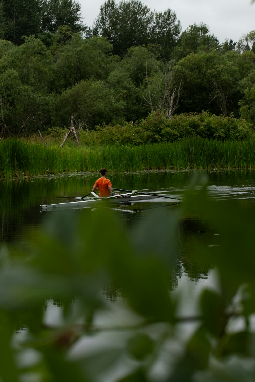 a person in a canoe paddling through the water