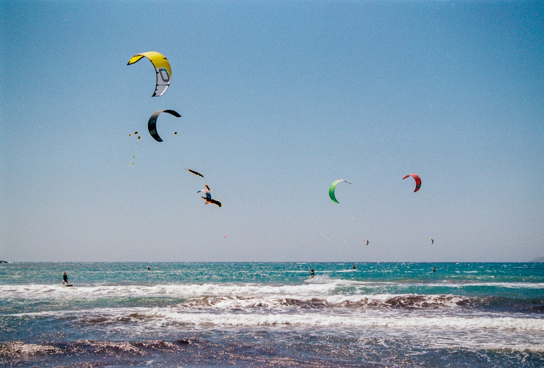 ❓ FAQ: Your Burning Beach Fitness Questions Answered by Fitness and Nature A group of people flying kites over the ocean